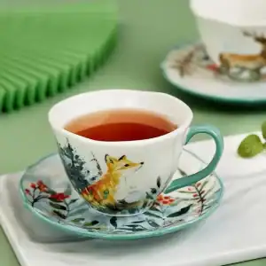 كوب قهوة سيراميك مع صحن رسم ثعلب برتقالي وحواف خضراء سعة 200 مل