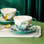 كوب قهوة سيراميك مع صحن رسم بومة بيضاء وحواف خضراء سعة 200 مل