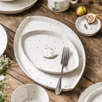 صحن تقديم بيضاوي سيراميك أبيض رسمة زهرة الزنبق