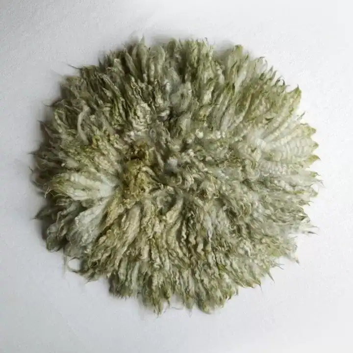 بساط فلوكاتي دائري من صوف الخروف الأسترالي الطبيعي بعدة ألوان لتصوير المواليد بأسلوب فني فاخر