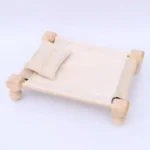 سرير تصوير مواليد خشبي مع مخدة قماش لون بيج كريمي محايد