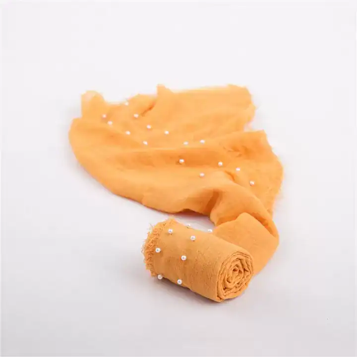 لفة قماش قطن لتصوير المواليد لون اصفر مانجو ذهبي مزينة بحبات اللؤلؤ