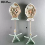 تعليقة جدارية سمكة ممتلئة بالأصداف الطبيعية مع نجمة بحر متدلية بحبل خيش ديكور بحري