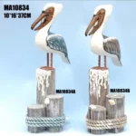 منحوتة خشبية يدوية لطائر البجع البحري فوق قاعدة خشبية بحبال وصدف ديكور ساحلي