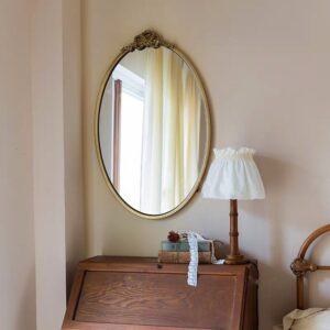 مرآة جدارية بيضاوية كبيرة اطار معدني ذهبي مع فيونكة للمداخل وغرف النوم